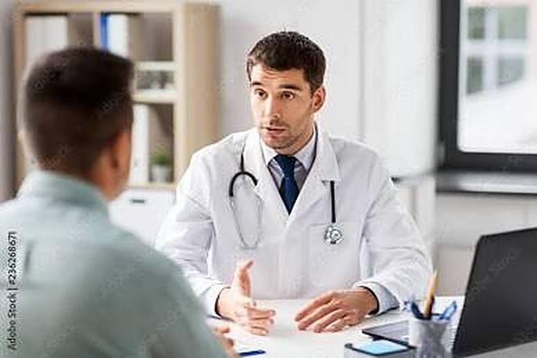 A doctor talking with a patient in an office