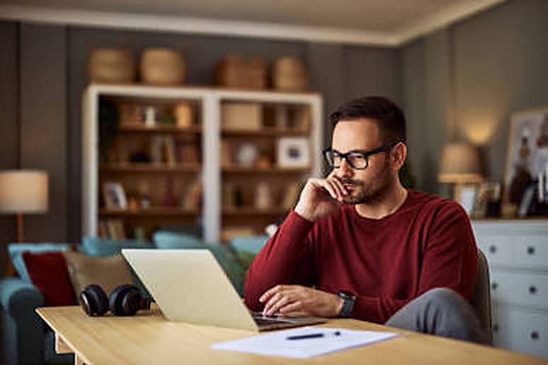 A man using a laptop at home